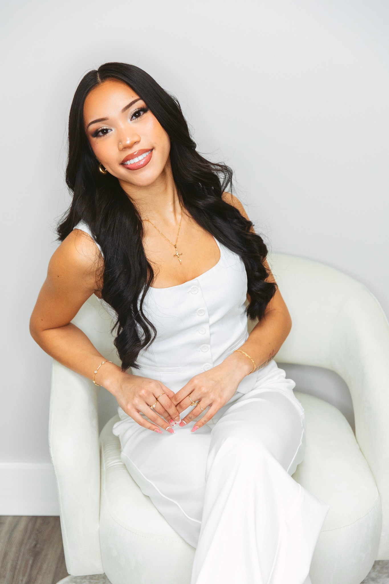 Abigaille Palileo, owner and artist at Winx Beauty Inks, seated in her studio